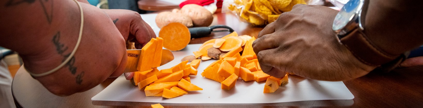 Hands cutting vegetables