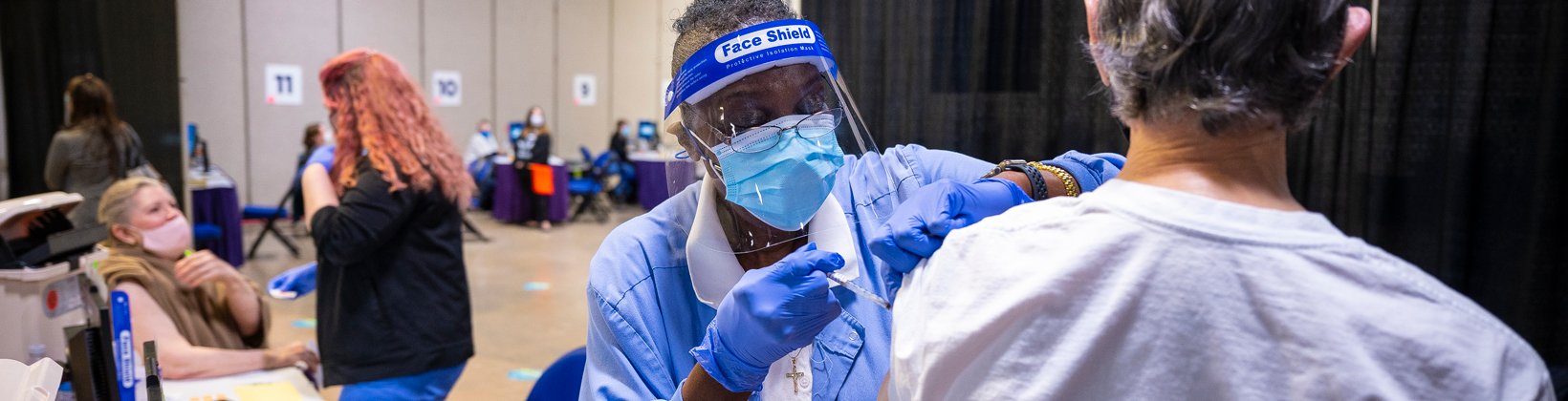 Cone employees with patients getting vaccinated